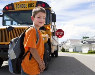 young boy going to school