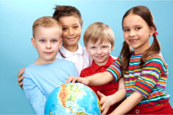 group of students holding the globe