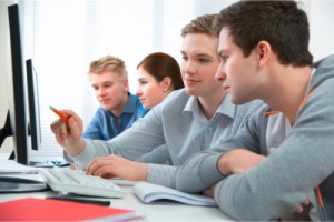 students learning in an ongoing computer class